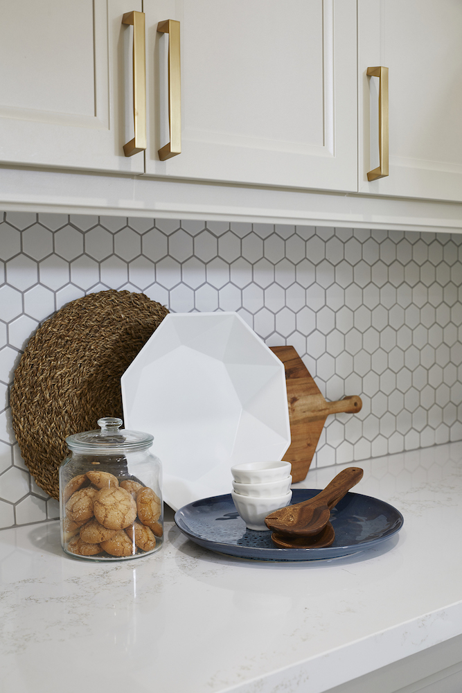 kitchen counter with hexagonal backsplash and cookies on counter