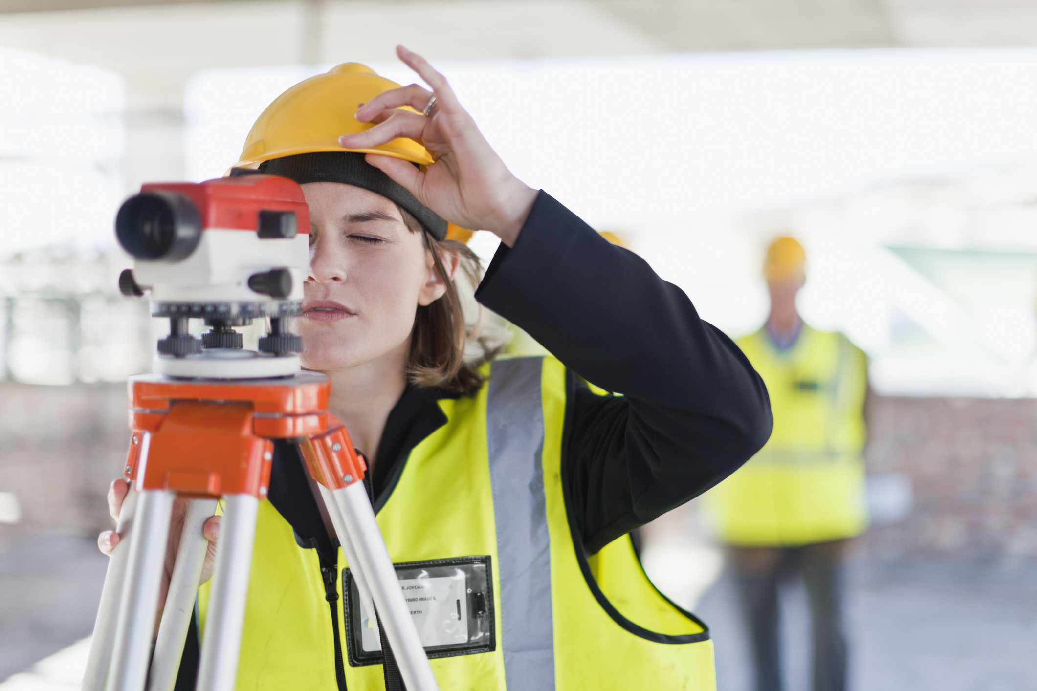 Construction worker using equipment