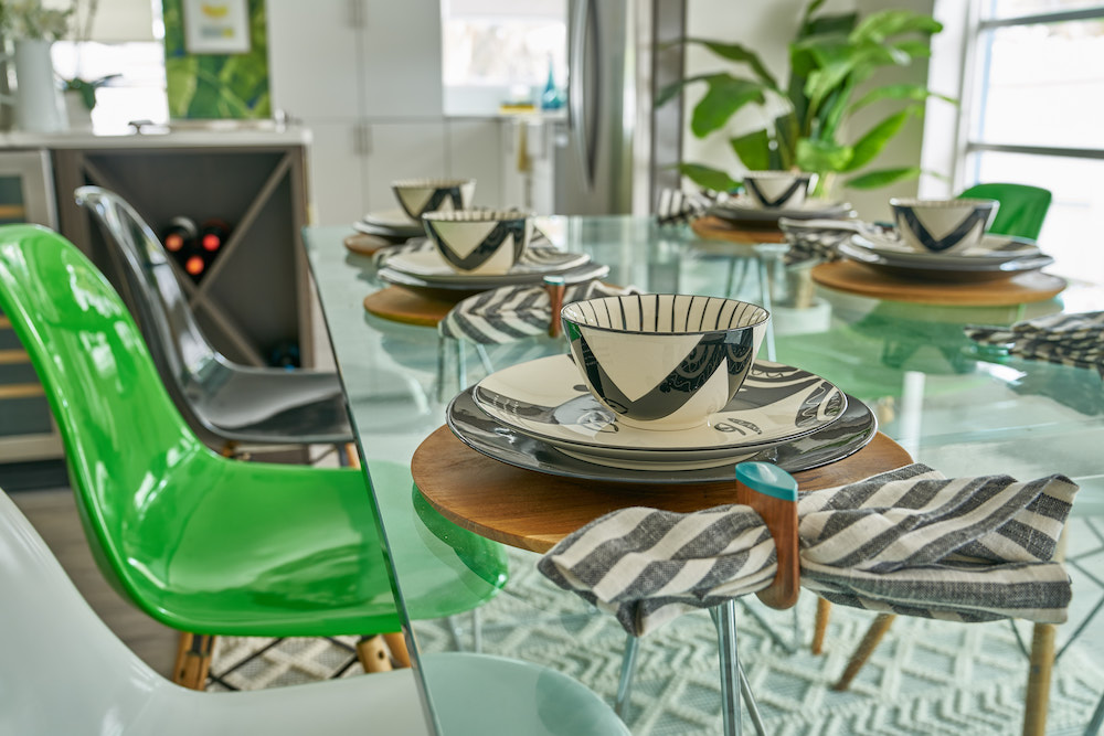 Buyers Bootcamp swimming pool bungalow chic green and black table settings on the new glass dining-room table