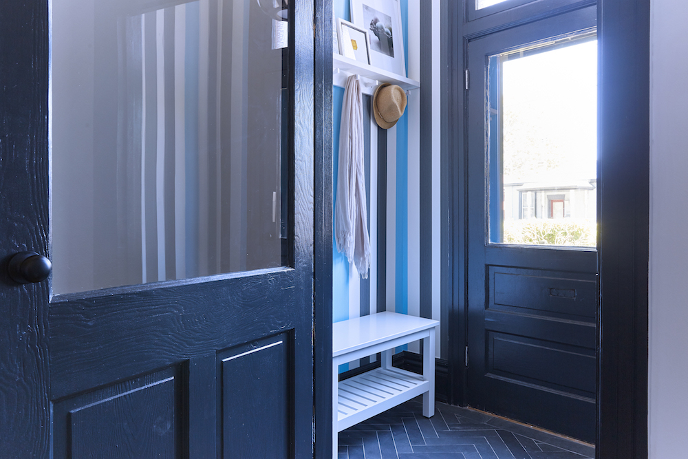 Buyers Bootcamp Victorian character home front entryway with herringbone tile and blue striped wallpaper