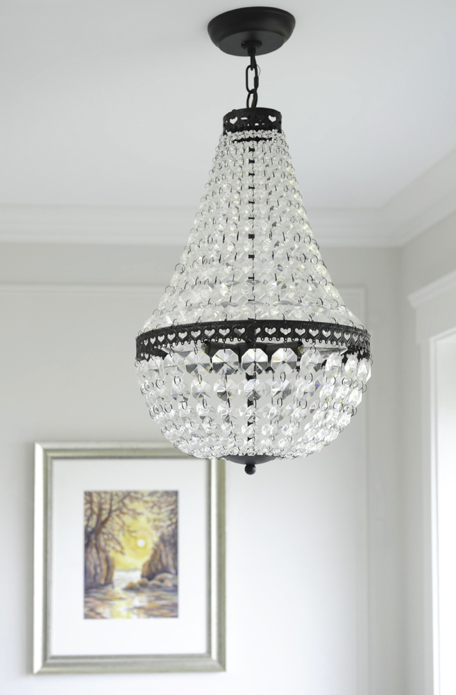 A sparkly chandelier hung in an ensuite bathroom.