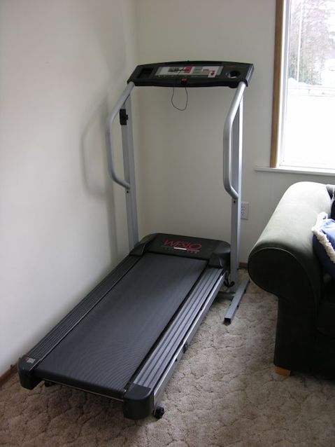 Treadmill in corner of a room