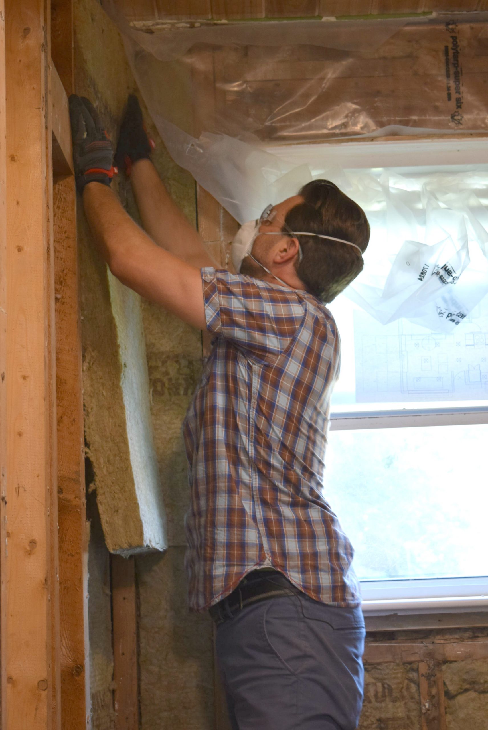 Scott McGillivray installing insulation