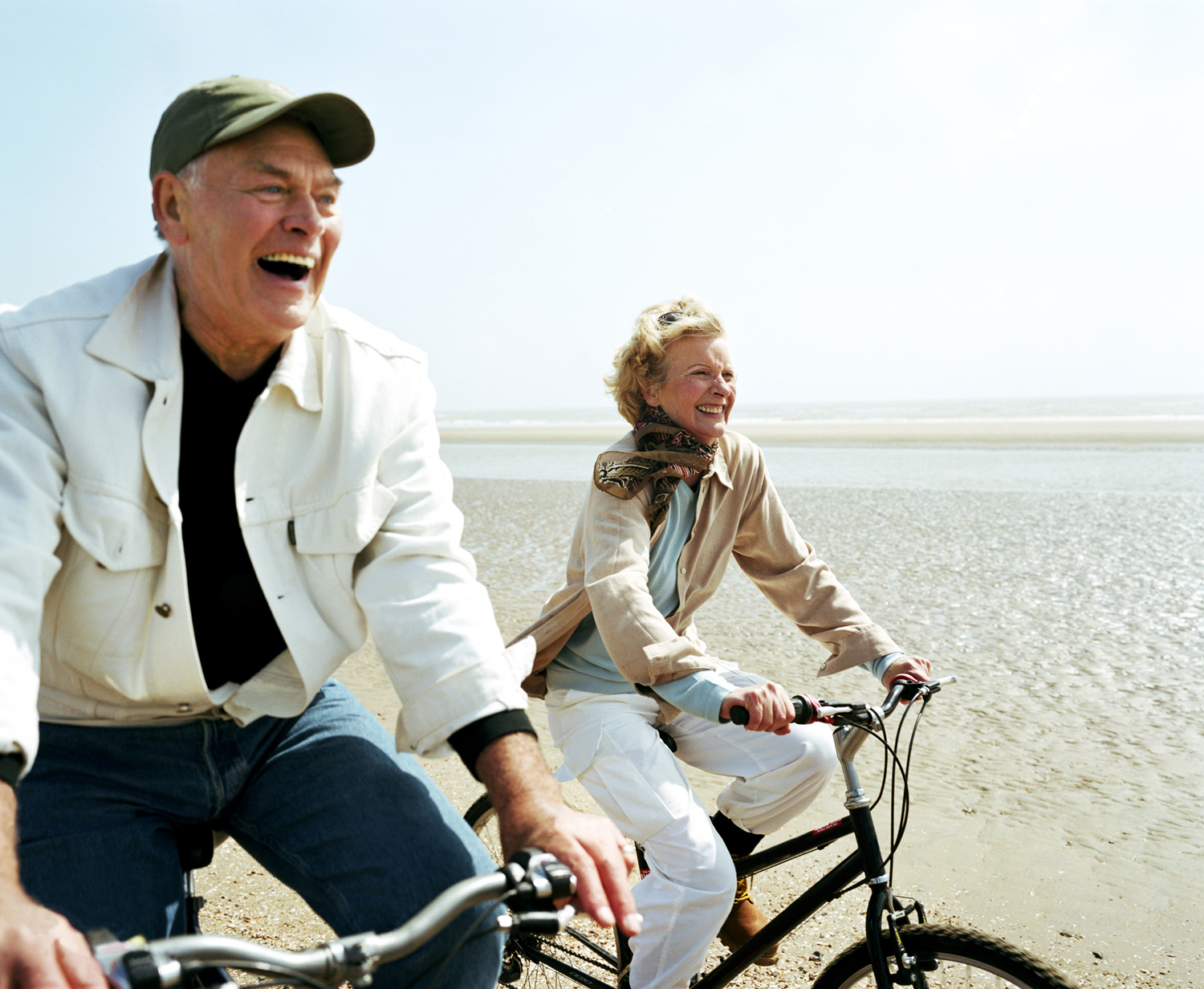 Elderly couple riding bicycles