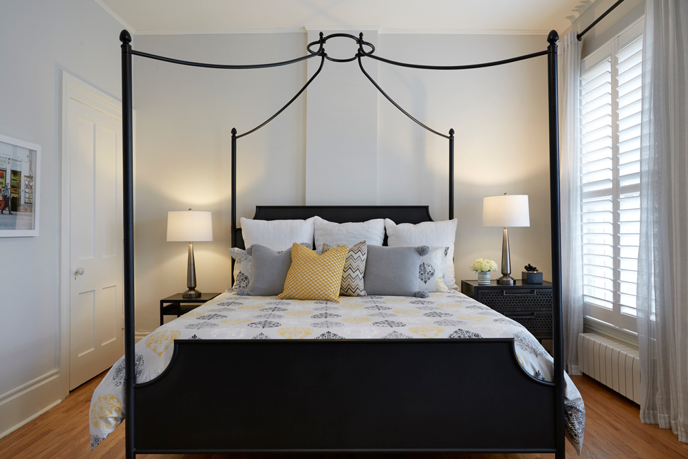 Master bedroom with yellow, black and white palette.