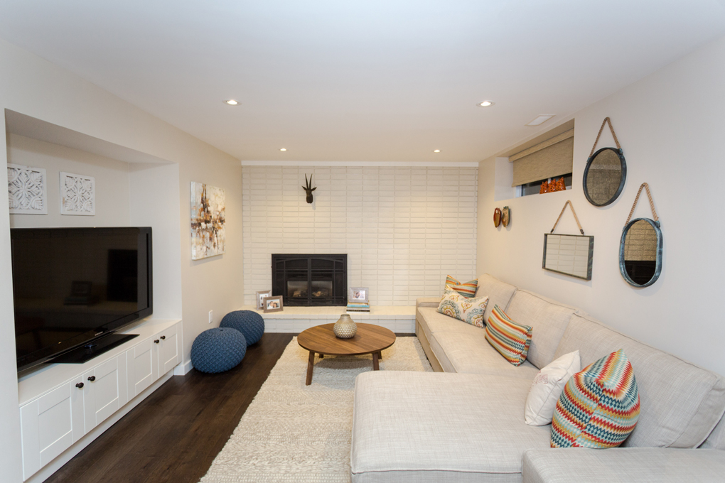 a white basement with tailored furniture
