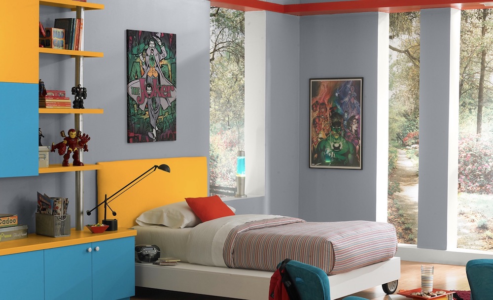 Funky child’s room with floor to ceiling windows, comic art, and bright primary colours painted on the walls with BEHR French Silver PPU18-5, Popped Corn W-B-200, Blue Jewel 510B-6 and Extreme Yellow P260-7