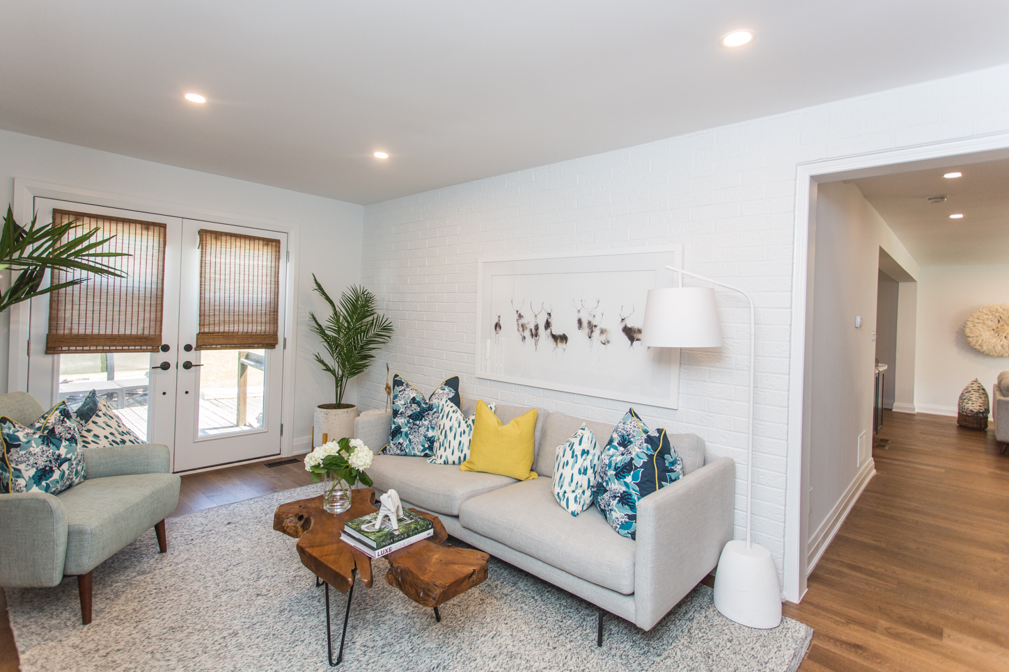 Whitewashing a brick wall saved cash while adding texture and dimension to the space.