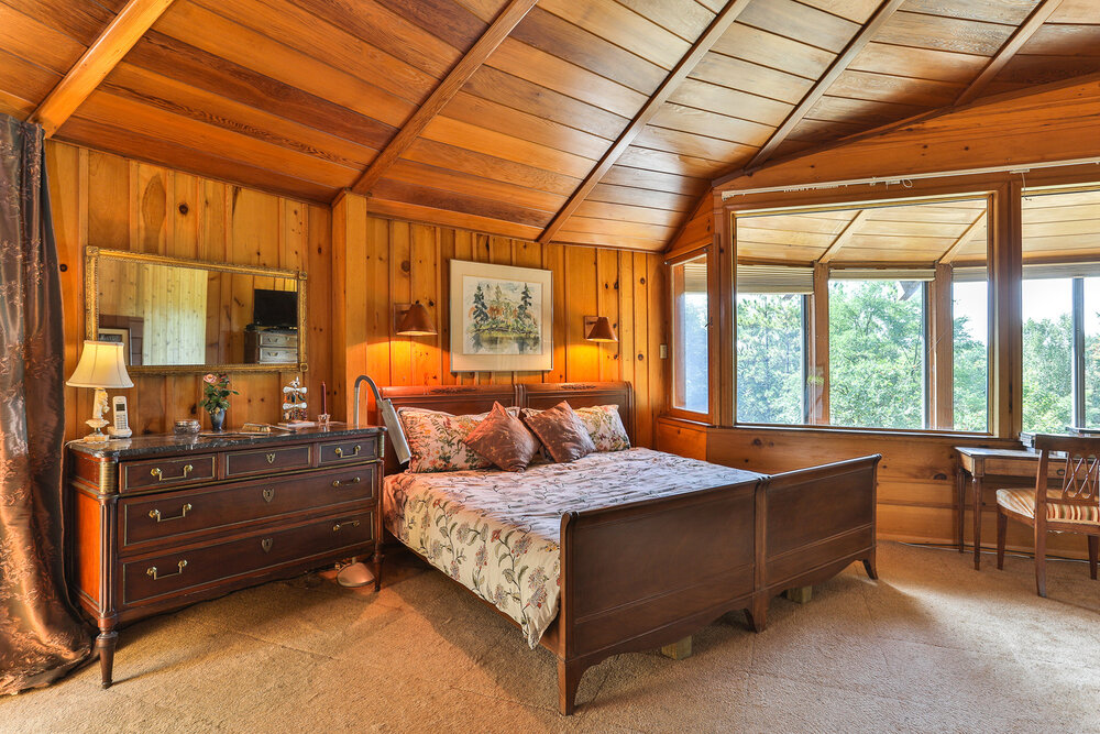 Wood panelled bedroom