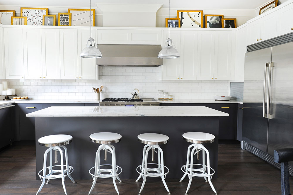 Modern kitchen with white uppers, subway tile backsplash and dark lowers.
