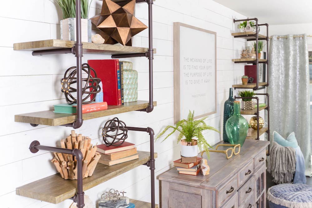 Masters of Flip split level metal hanging book shelves with vintage books, metal objects and glass vases