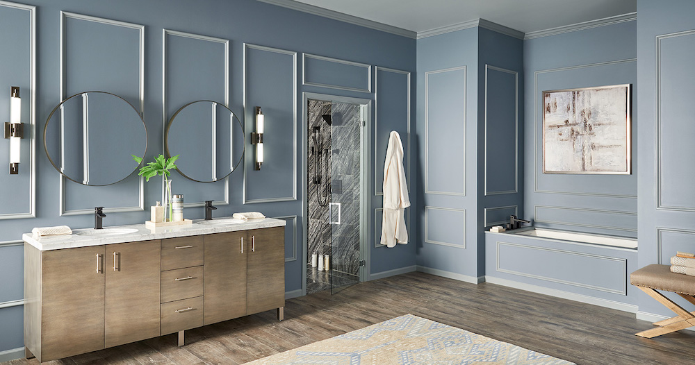 Large modern bathroom with a double sink wooden vanity, two round vanity mirrors, wide plank wood floors, enclaved bathtub with art hanging about it, shower room, and blue walls painted in BEHR Shadow Blue N480-3 with white trim in BEHR Meteor Shower N450-3