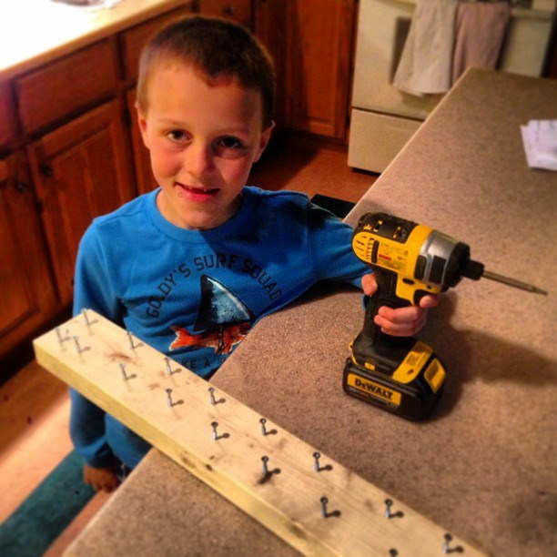 Quintyn working with power tools.