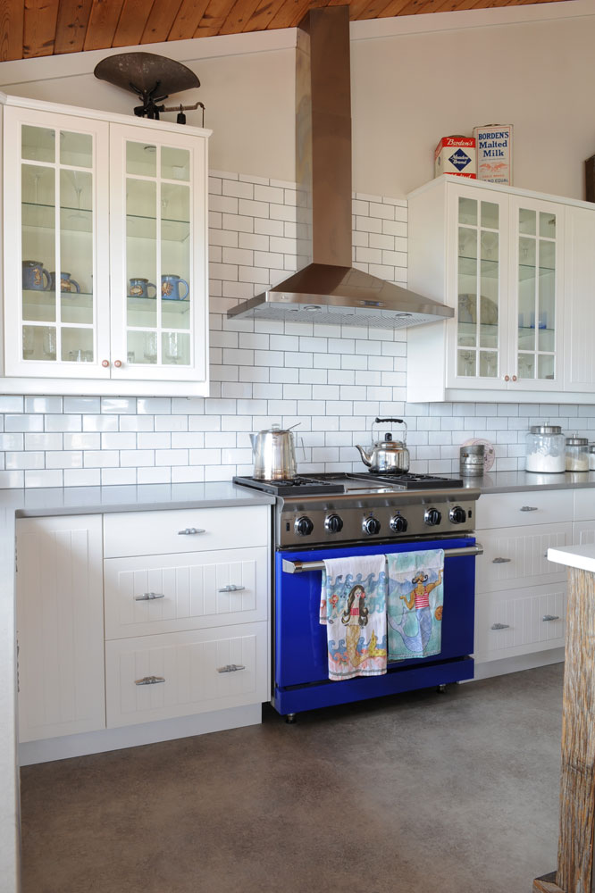 Use subway tile to draw the eye upwards, like in this cottage kitchen