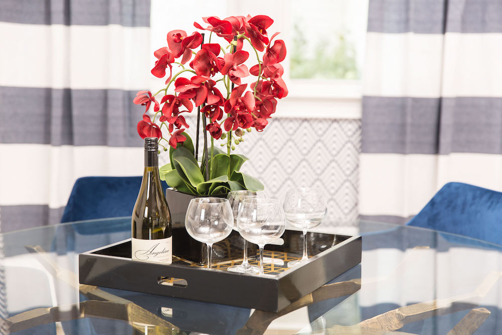 Masters of Flip primary colour renovation dining room tray with red orchid and wine glasses