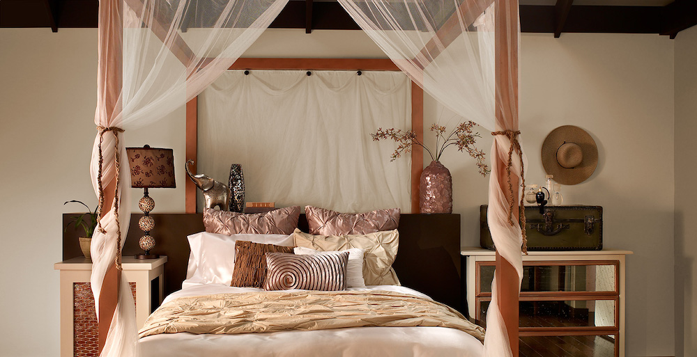 Pretty Asian-inspired bedroom with a large canopy bed, silk bedding in various shades of bronze and cream, and walls painted with BEHR Off White 73, Havana Coffee N210-7 and Shiitake N220-4