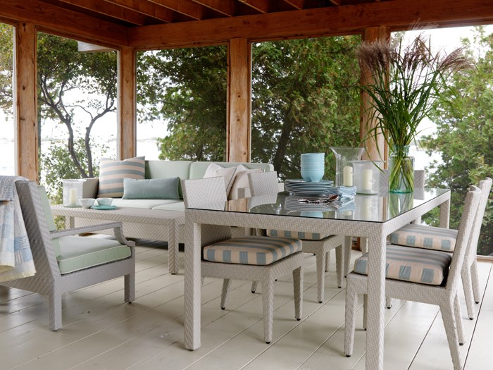 White and pastel blue patio furniture on a cottage deck