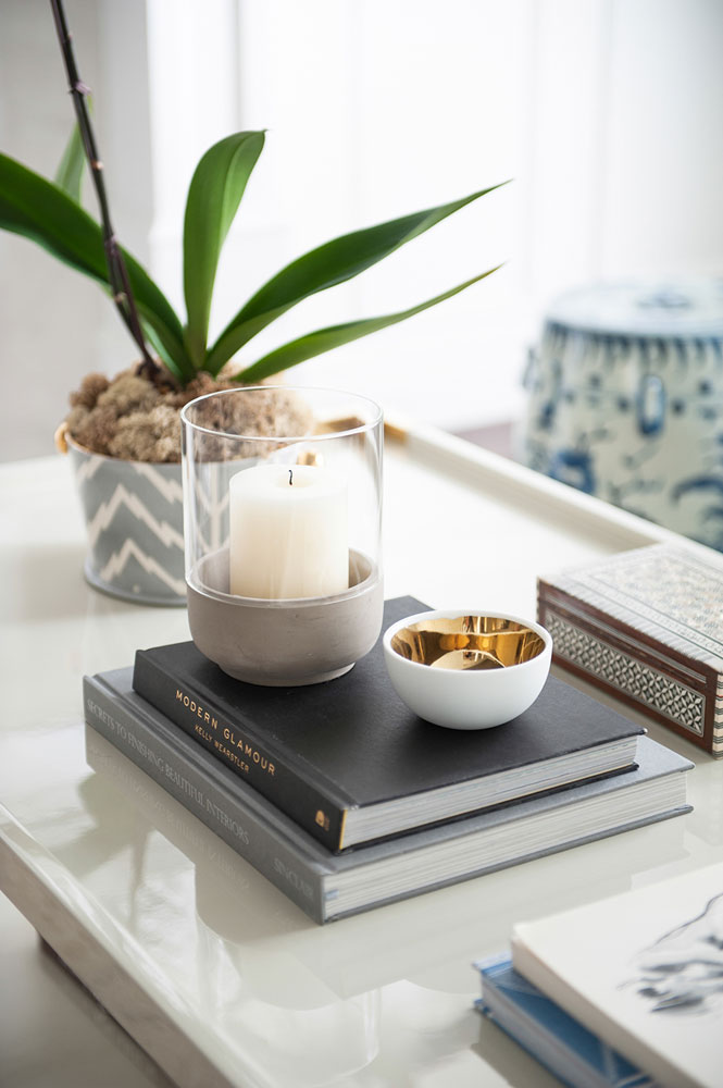 Stylish Coffee Table With Small Dish, Books and Greenery