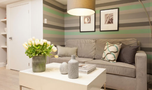 Living room with striped green and grey wall