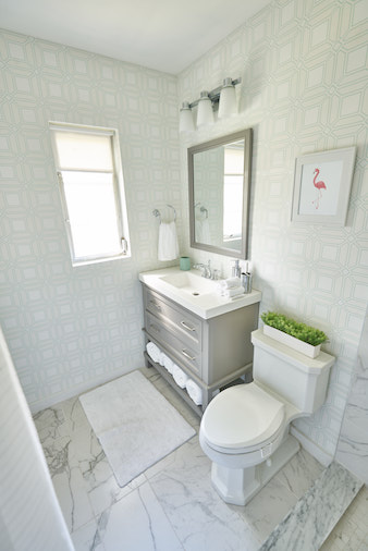 Wallpaper and new tile give this buyers bootcamp bathroom a modern twist