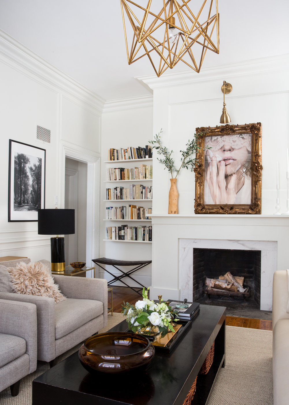 Parisian-inspired living room design with stylish fireplace mantel.