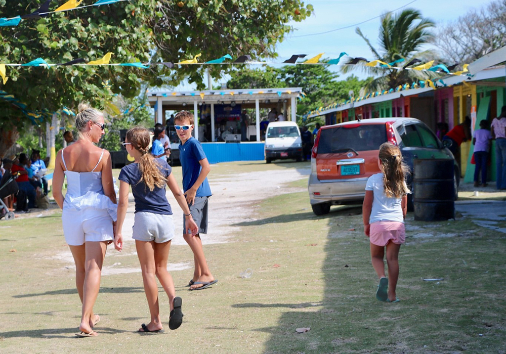 Sarah Baeumler and three of her children walk through town on South Andros Island