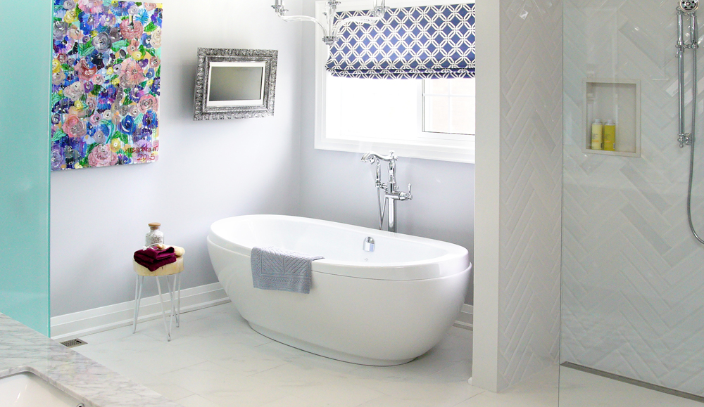 Bright white bathroom with pops of colour in wall art