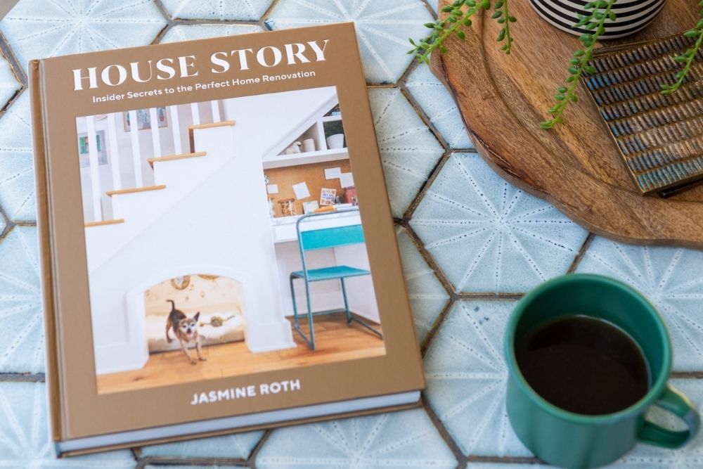 Jasmine Roth's new book House Story on a table with a coffee mug.