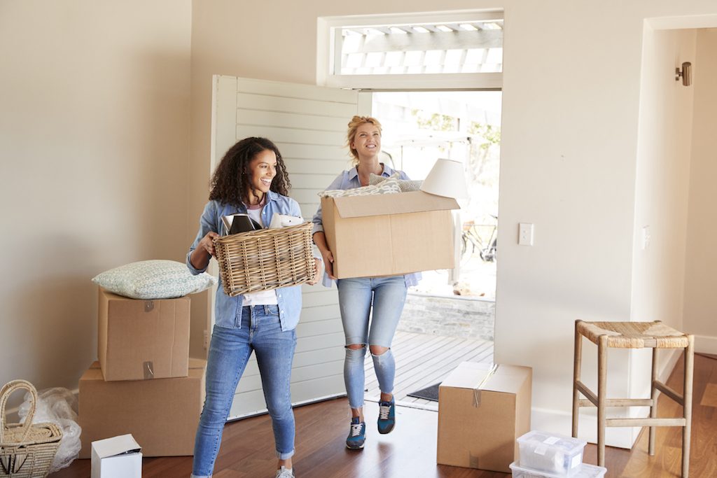 Women moving into apartment