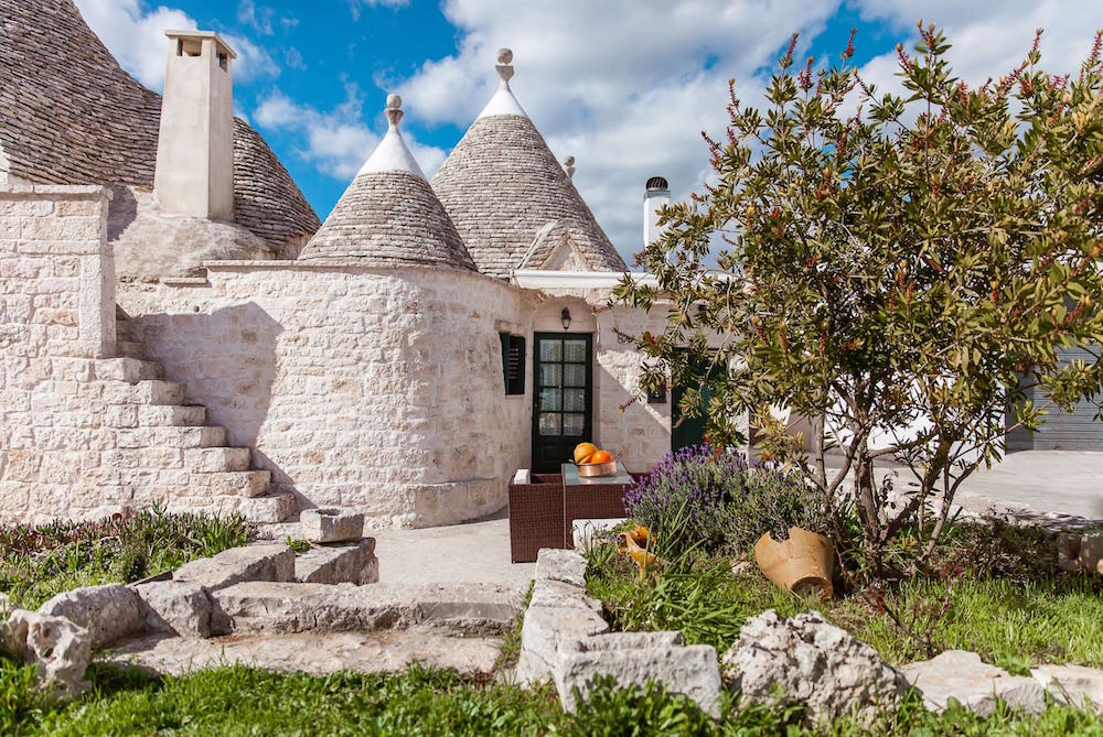 white trullo with cones at roof