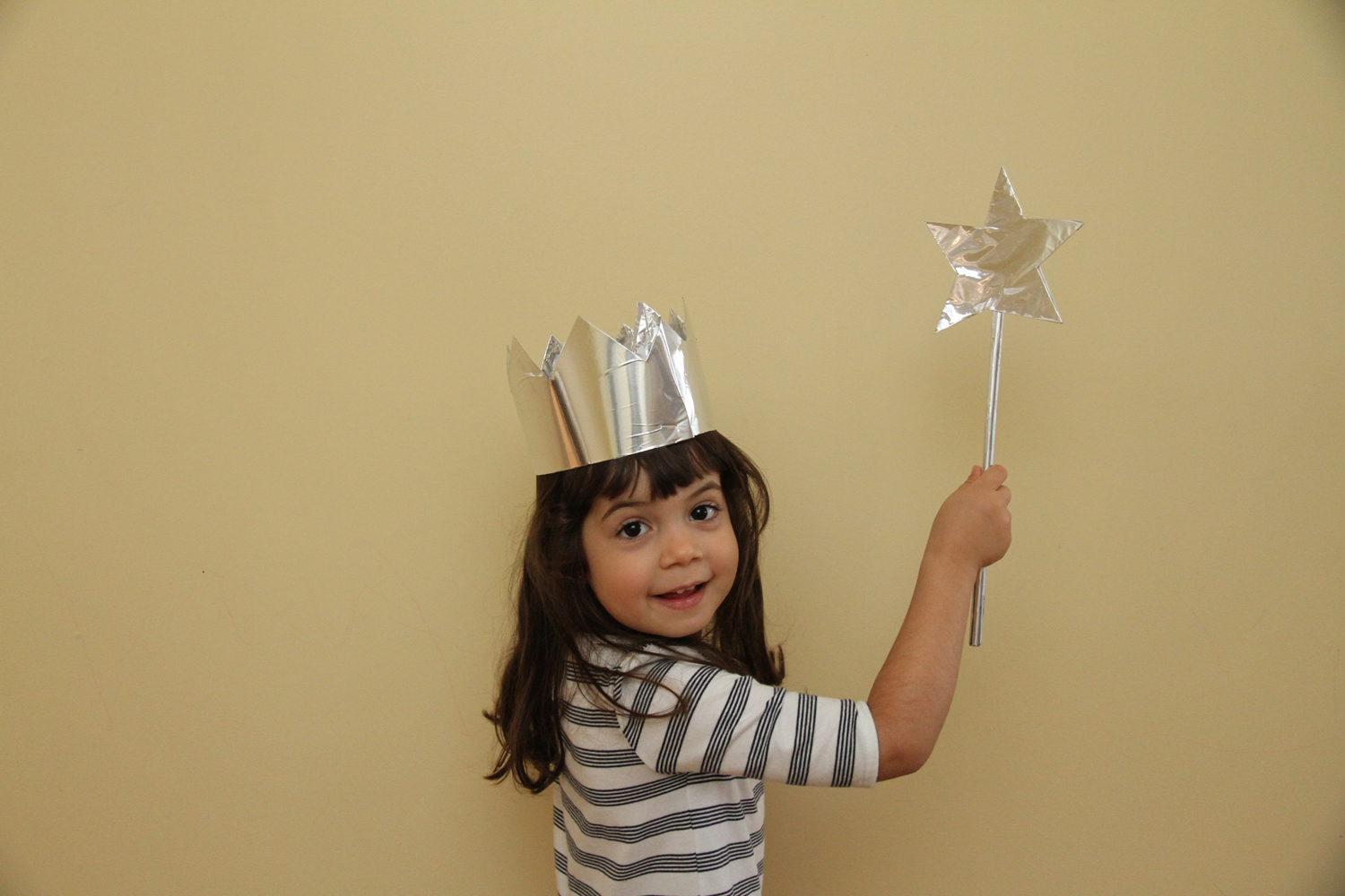 Little girl in aluminum foil princess costume