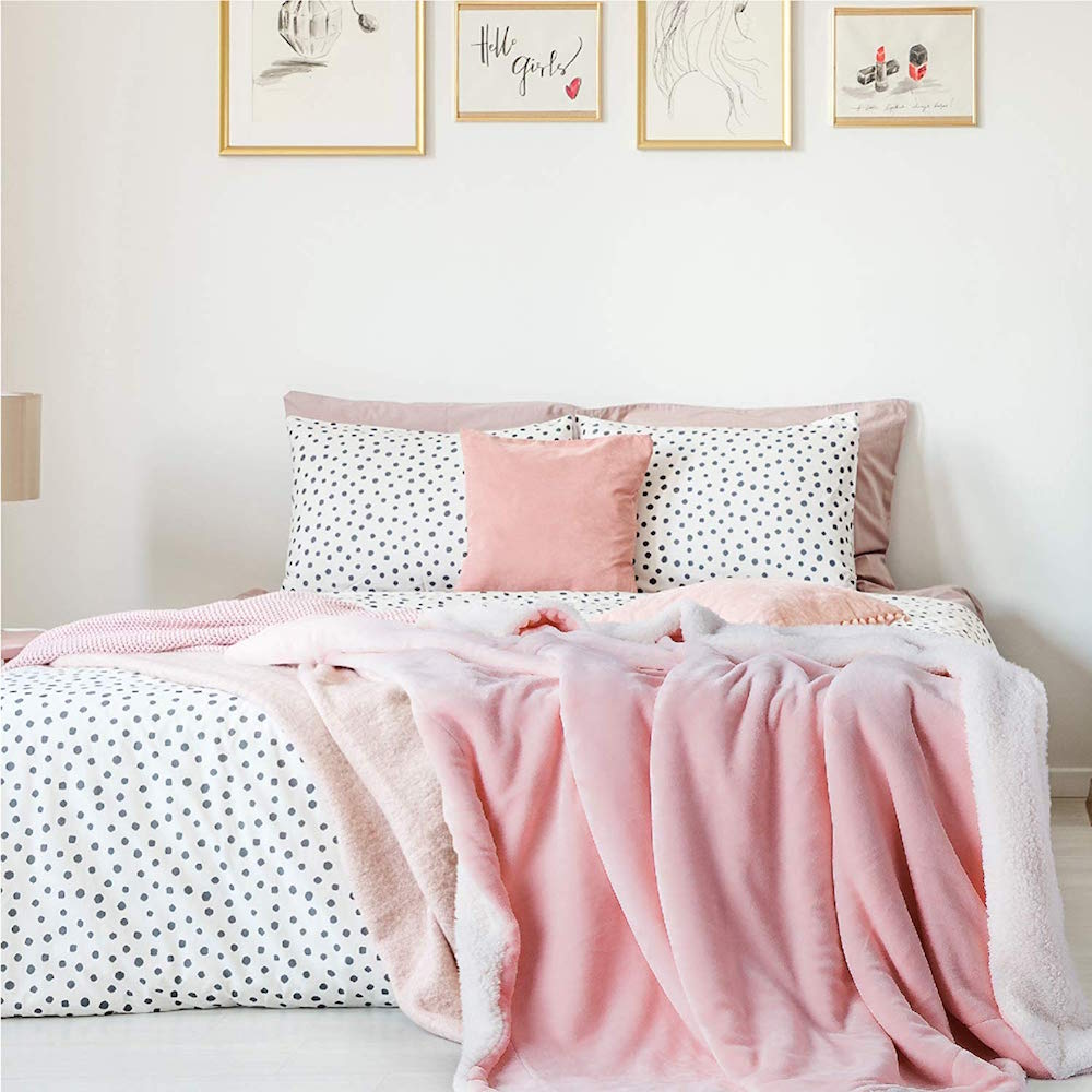 white bedroom with polka-dot and pink bedding