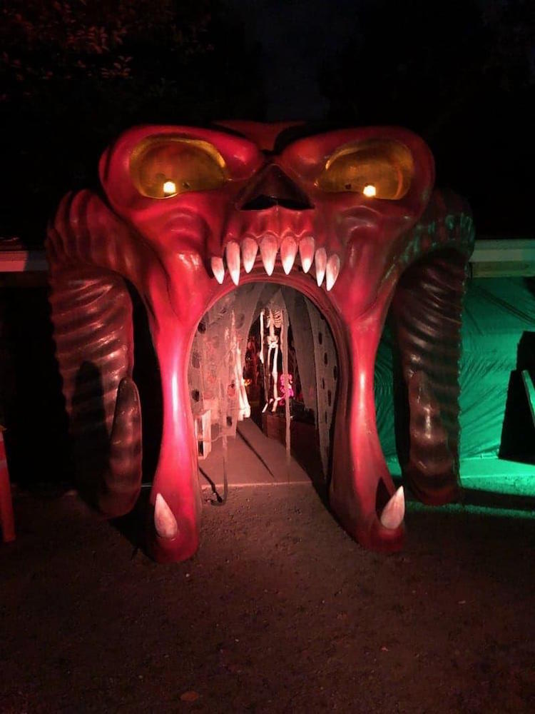red skull monster entryway with skeletons inside