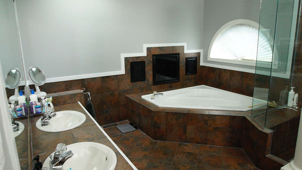 Old tiled bathroom with deep soaker tub