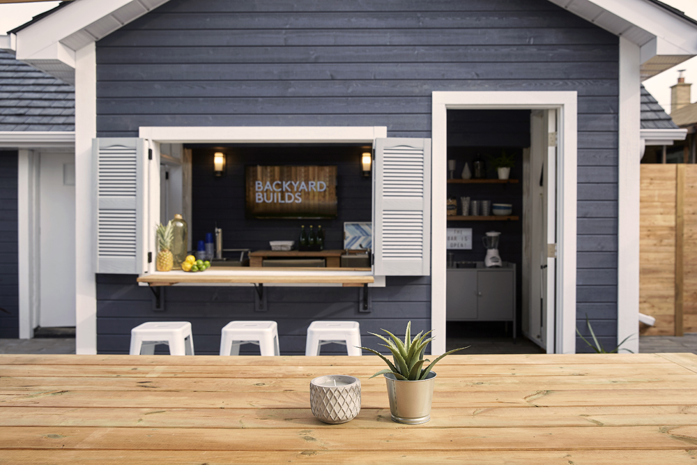 A backyard bar in a renovated shed with plenty of seating space