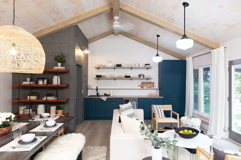 converted garage with vaulted ceiling, dining area, kitchenette and lounge arrea