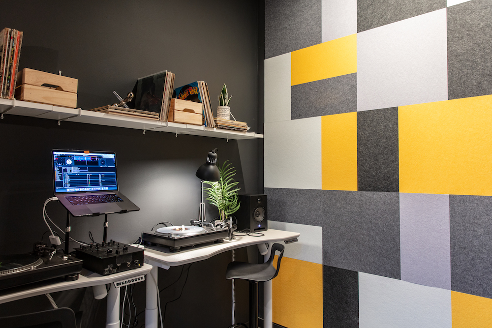 interior of home DJ studio with black and yellow panels
