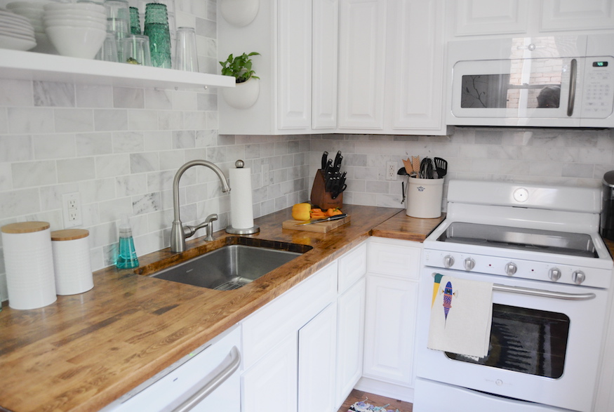 Small kitchen with grey subway tile backsplash