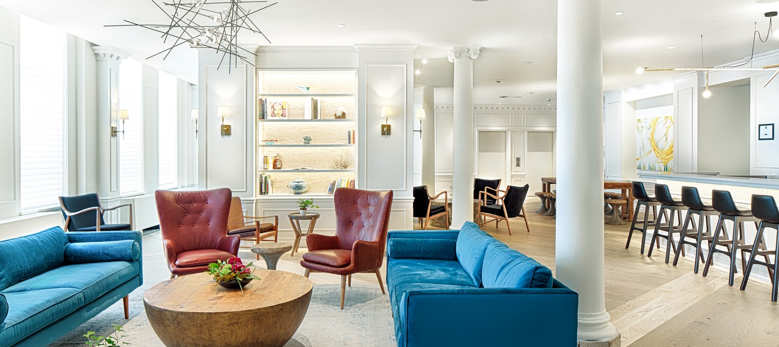 Chic, modern hotel lobby with bright blue sofas