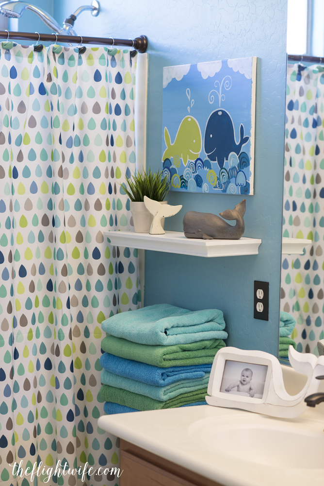 Colourful kids' bathroom with playful whale accessories.