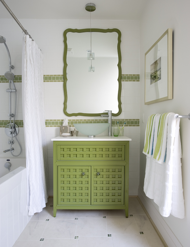 Green bathroom vanity with white sink