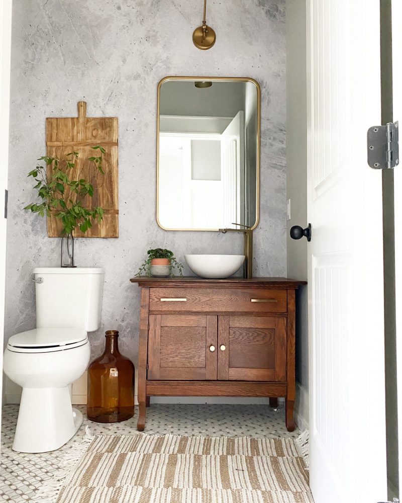 Repurposed vintage dresser as vanity in modern bathroom