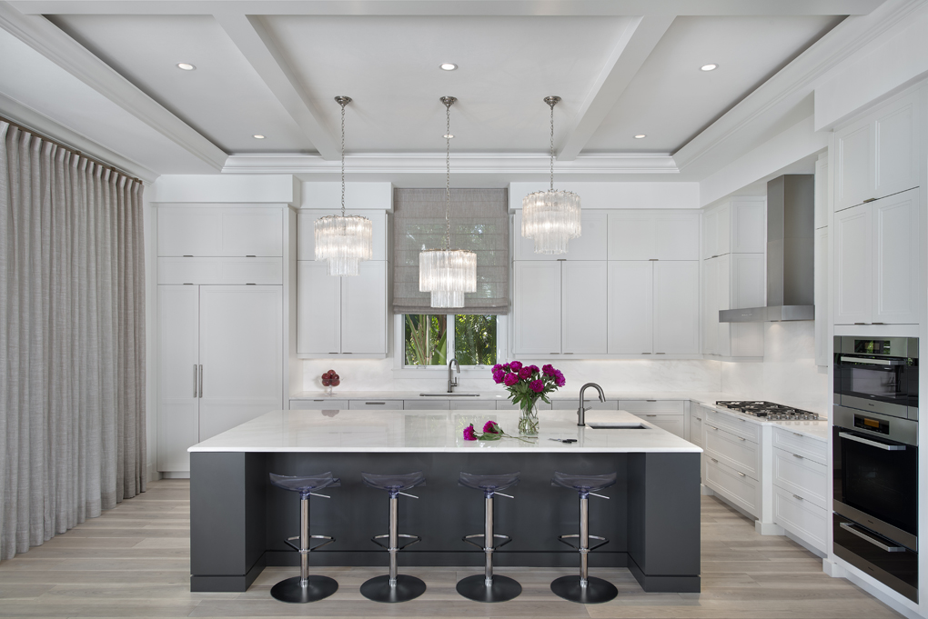 kitchen with island and chandeliers