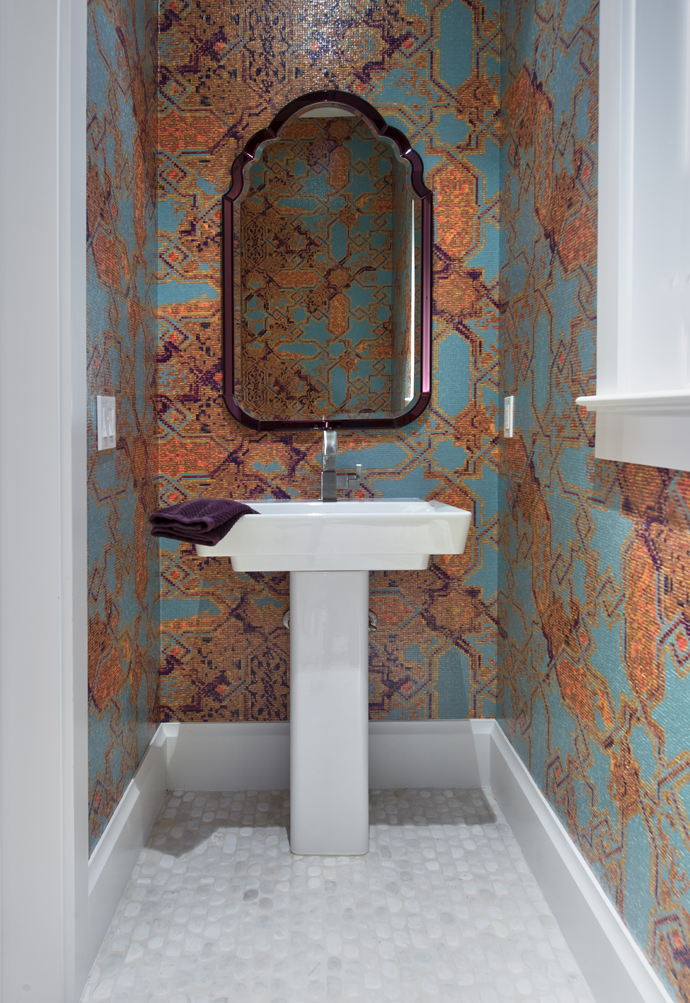 powder room with bright patterned wallpaper