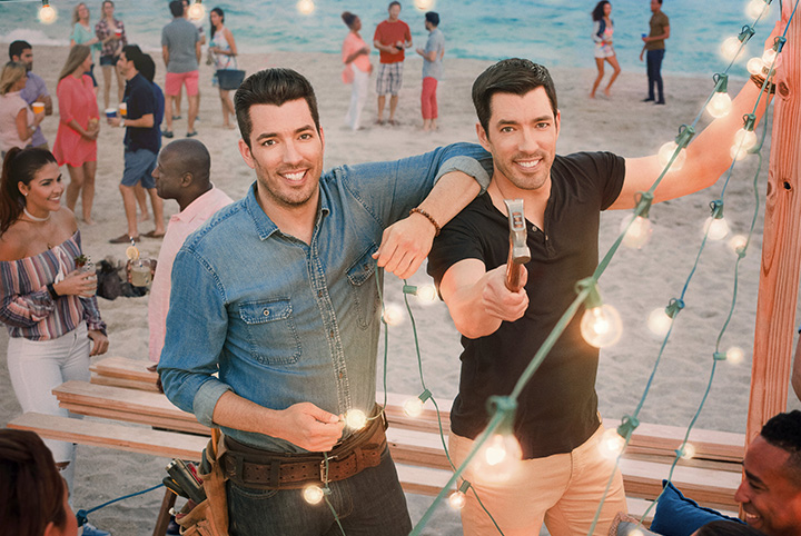 Drew and Jonathan Scott at an outdoor party