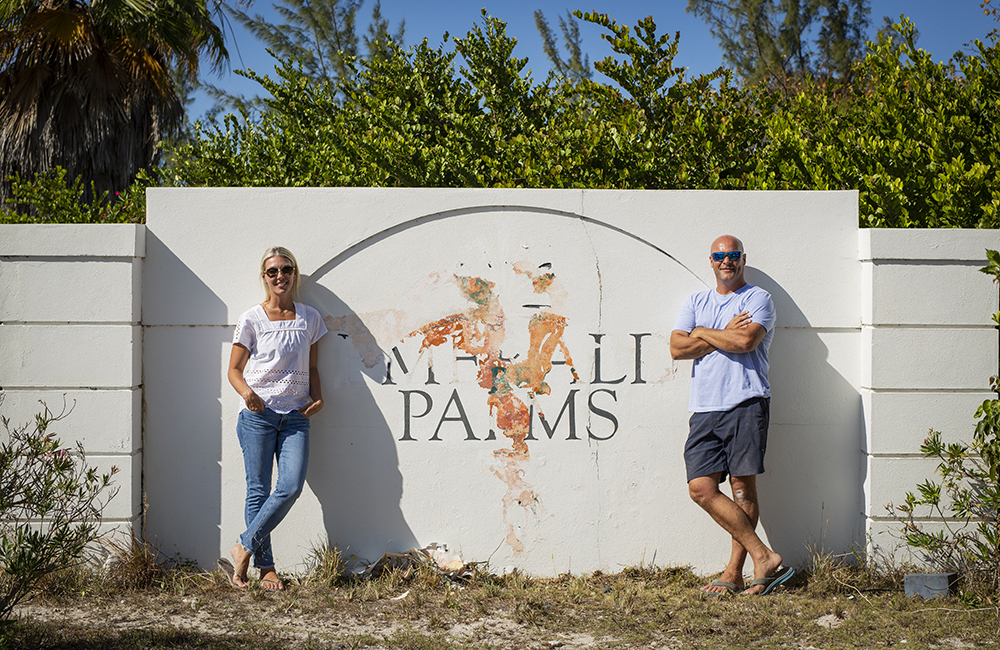 Sarah and Bryan Baeumler in front of their resort in The Bahamas
