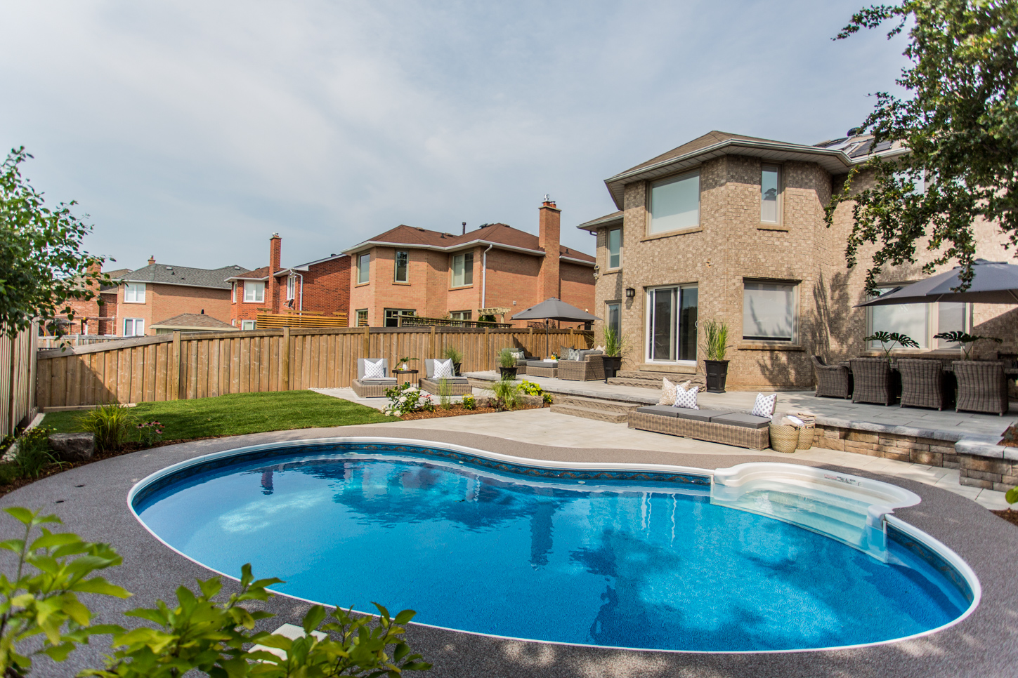 Backyard in suburbs with large swimming pool