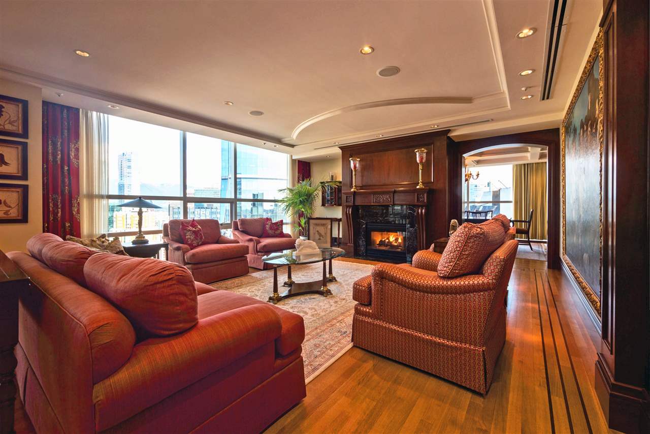 living room with fireplace and plush red couches