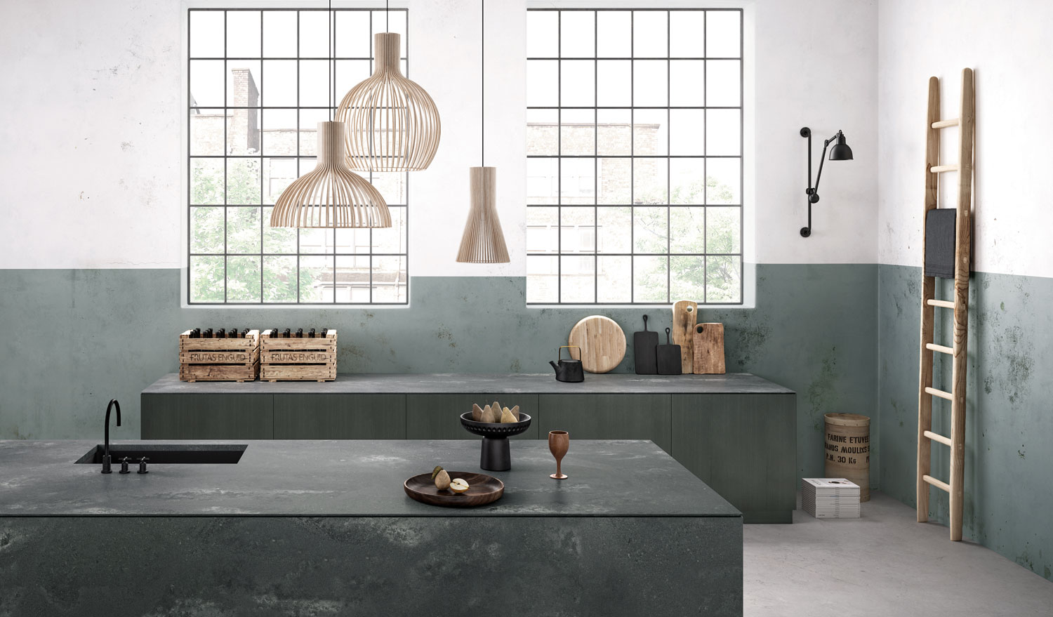 Artsy kitchen with grey sidling up the walls and a low grey island