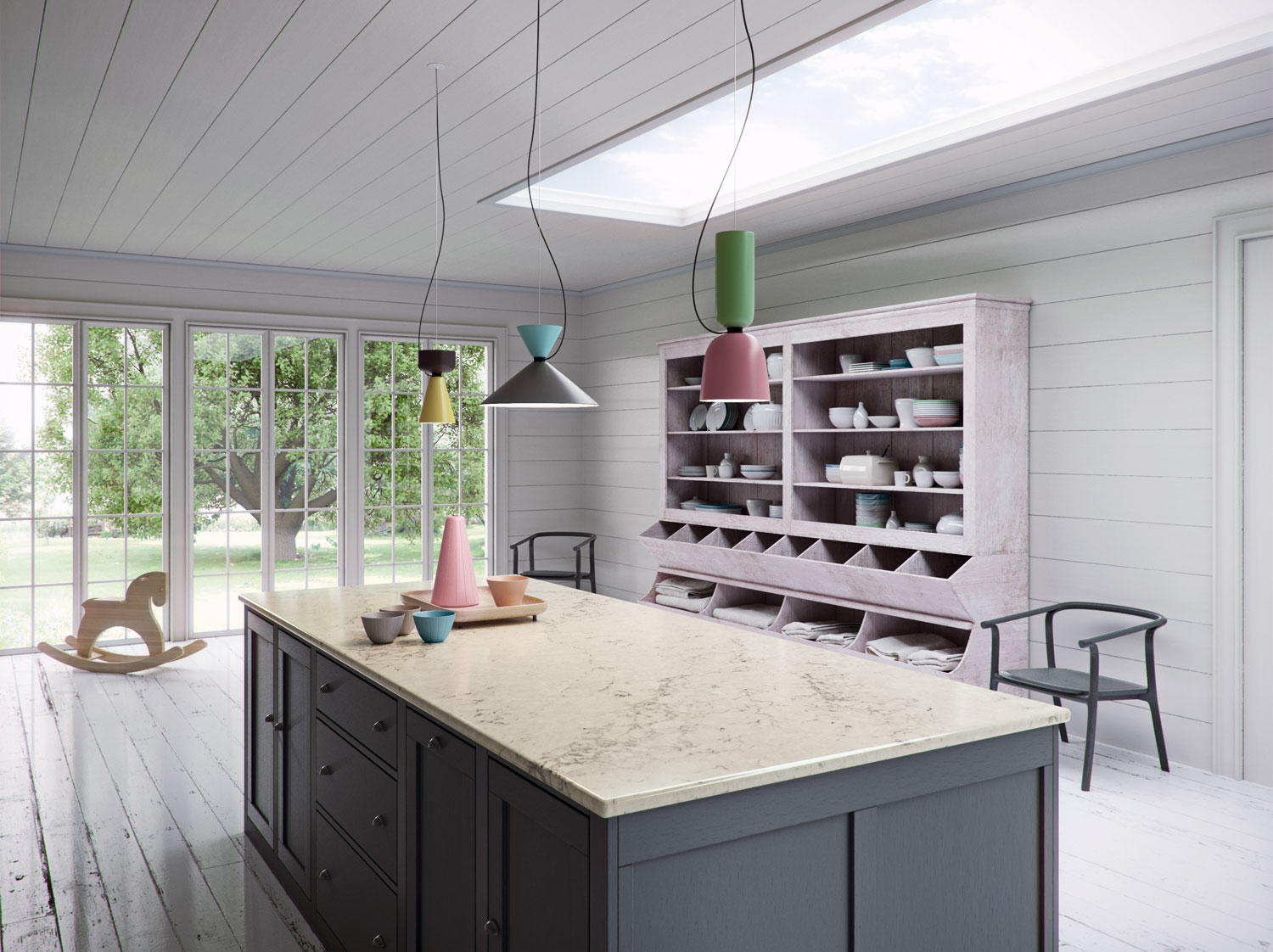 Stylish grey kitchen with oversized island in luxurious farmhouse setting